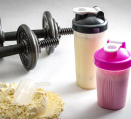 Workout Supplements: What Supplements Should I Take, dumbbells and protein shake bottle