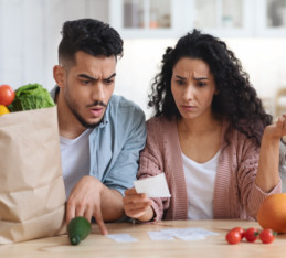 Middle Eastern couple looking at how to save money on groceries
