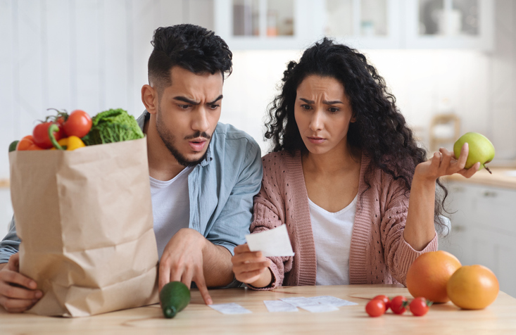 Middle Eastern couple looking at how to save money on groceries
